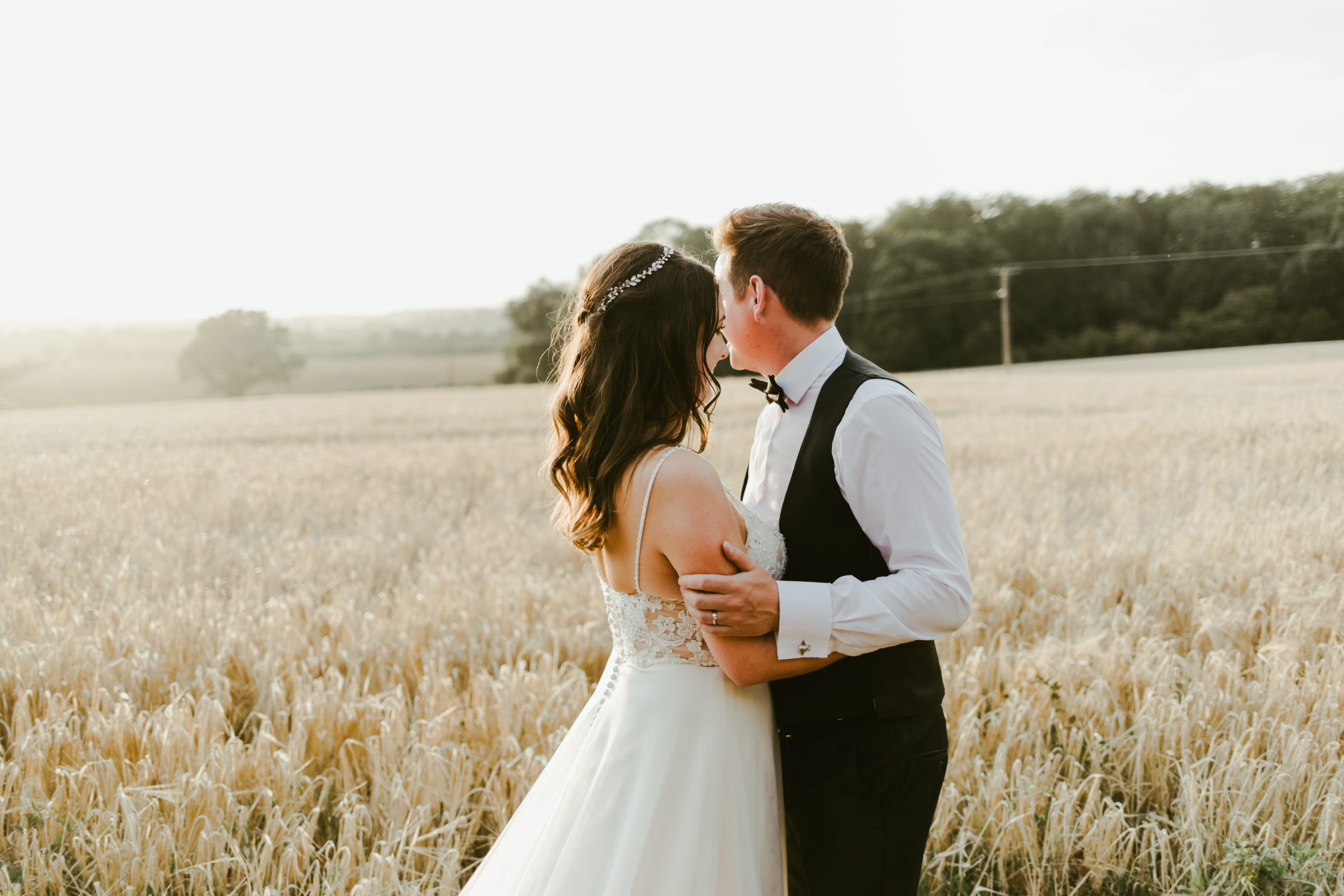 summer back garden marquee wedding bride and groom cornfield at sunset