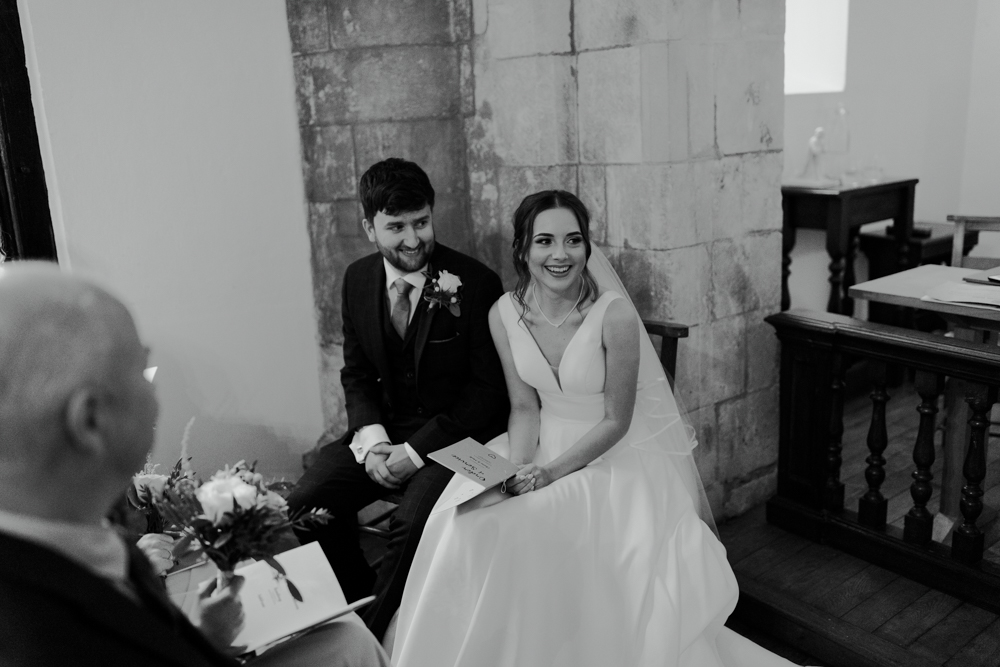 farnham castle wedding chapel ceremony bride and groom